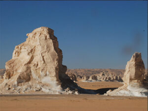 Limestone hills on sandy ground, with muted colors