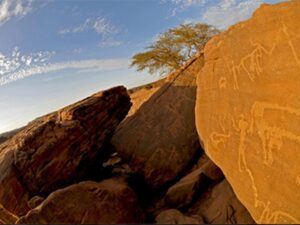 Rock engravings are illuminated by the sun