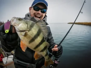 A man caught a big Angler fish next to the river