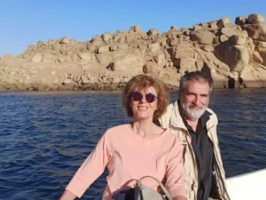 Couple on a boat with Nile River behind them