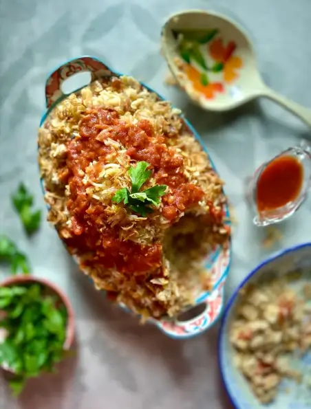 Lentil and rice in a dish with green garnish