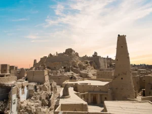 View of the town of Siwa Oasis against the setting sun